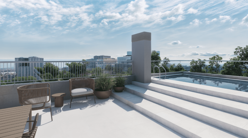 Community terrace with swimming pool and relaxation area in residential development with urban views