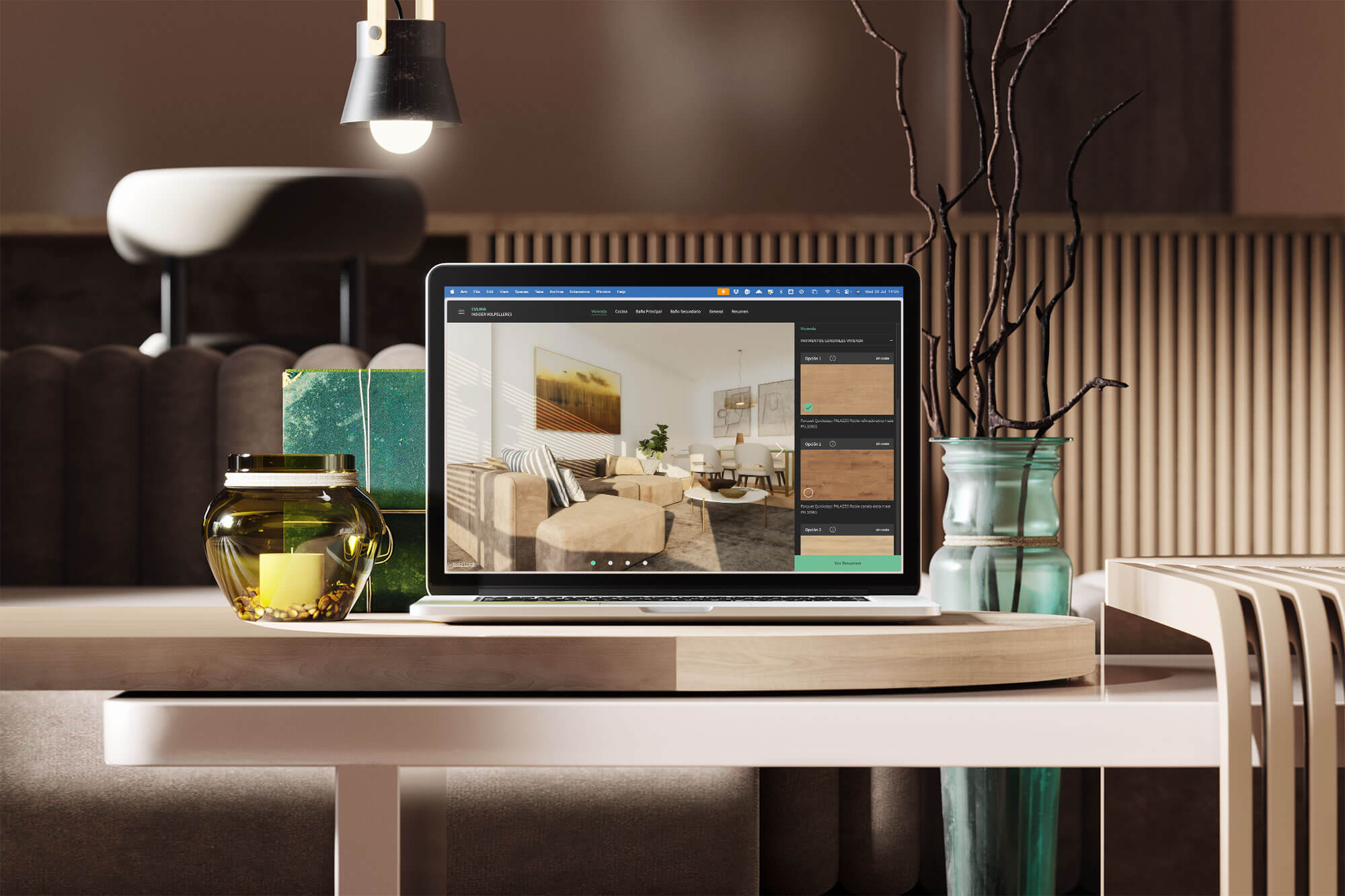Ordenador portátil sobre mesa con configurador de vivienda abierto en pantalla, en un entorno interior moderno